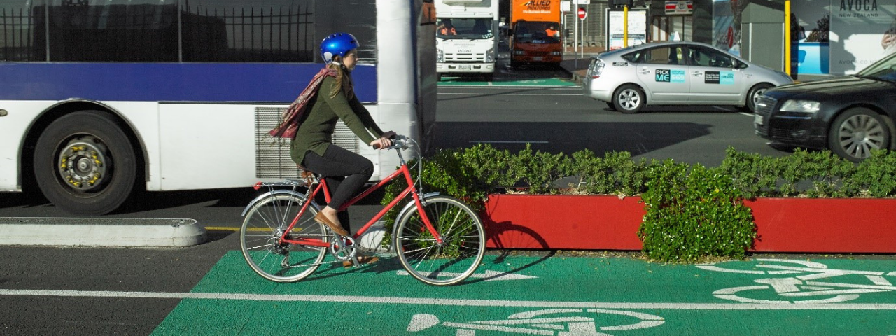 Auckland city centre cycle way with Auckland buses in back ground