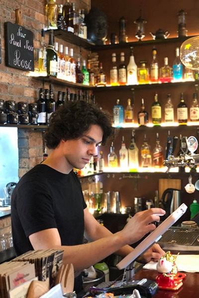 A man working at Indochine Kitchen